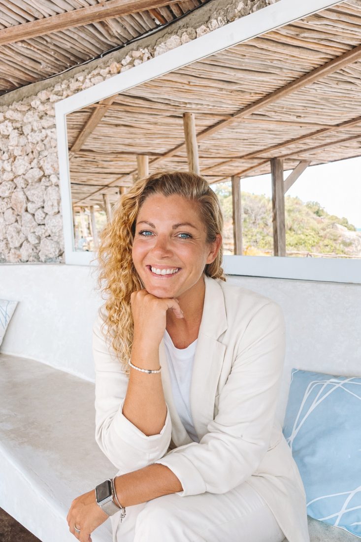 Verena Husemann smiling, in a cream blazer
