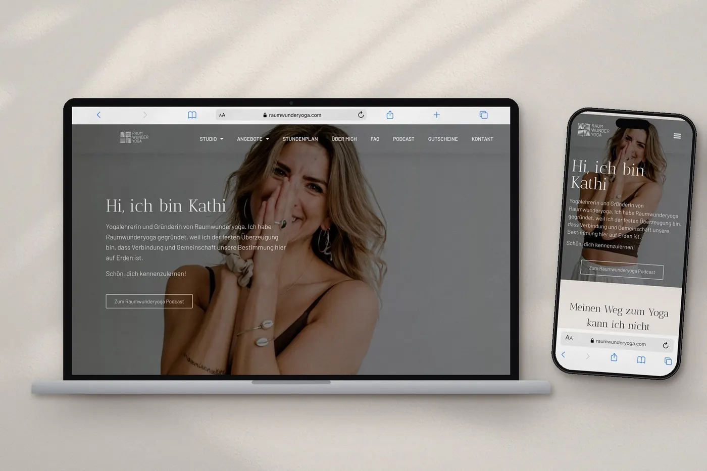 The Raumwunderyoga website on a laptop and a phone